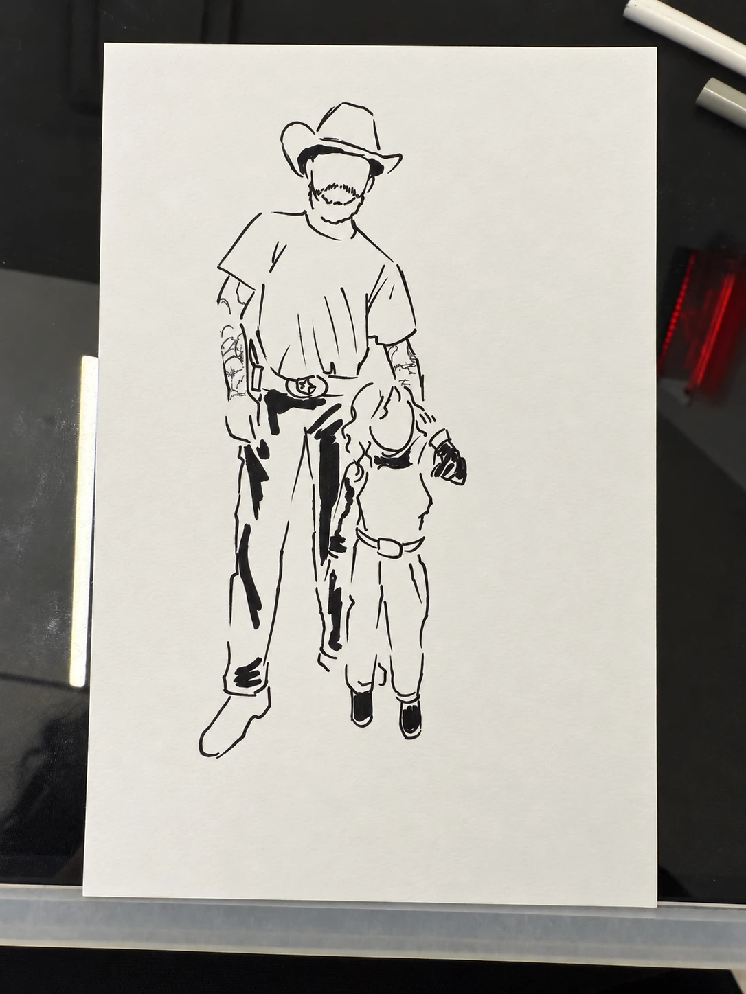 Minimal black-and-white paper fashion sketch of a man and child in cowboy hats