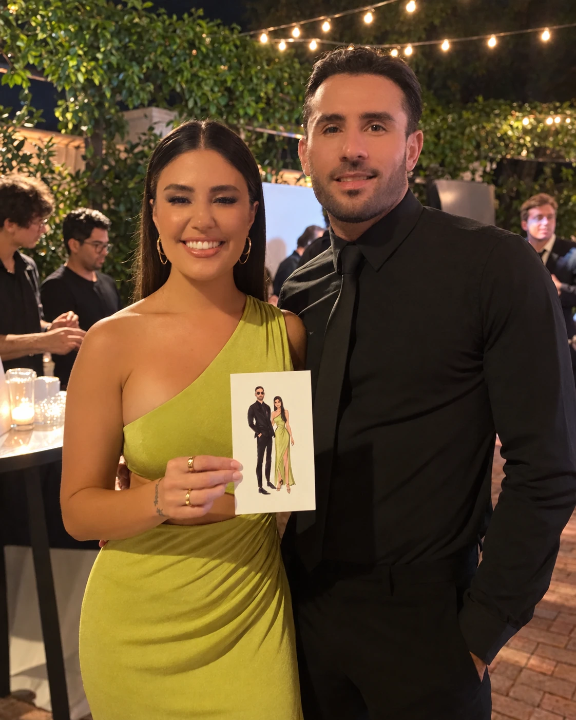 Two guests at an evening event holding their printed digital fashion sketch