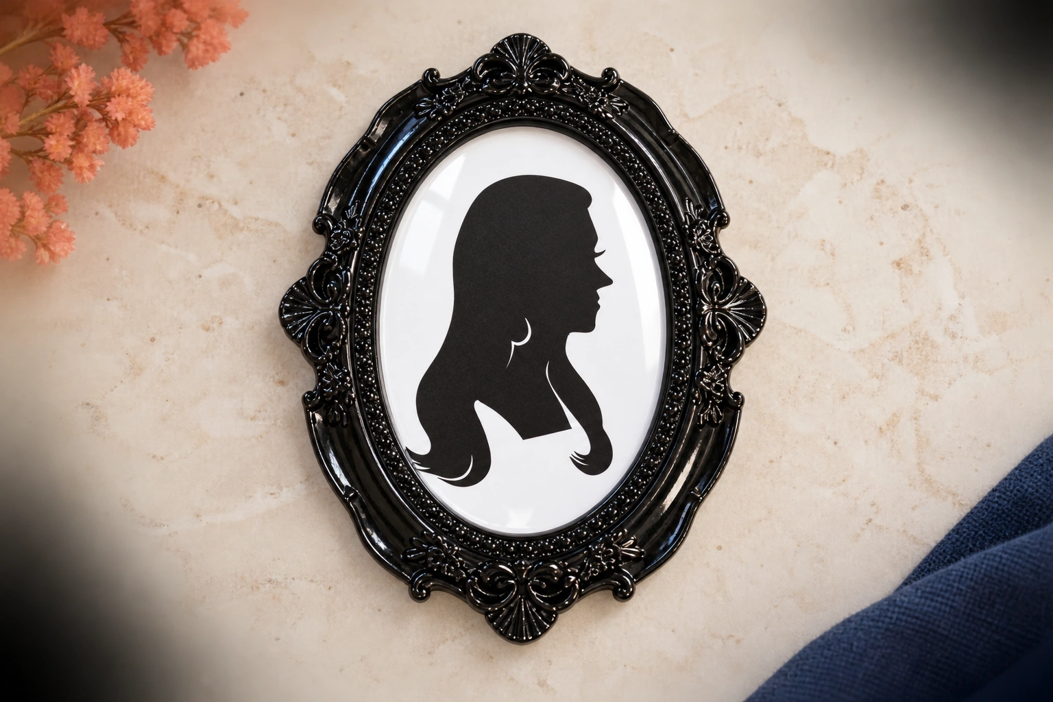 Silhouette sketch fitted into a black ornate miniature frame