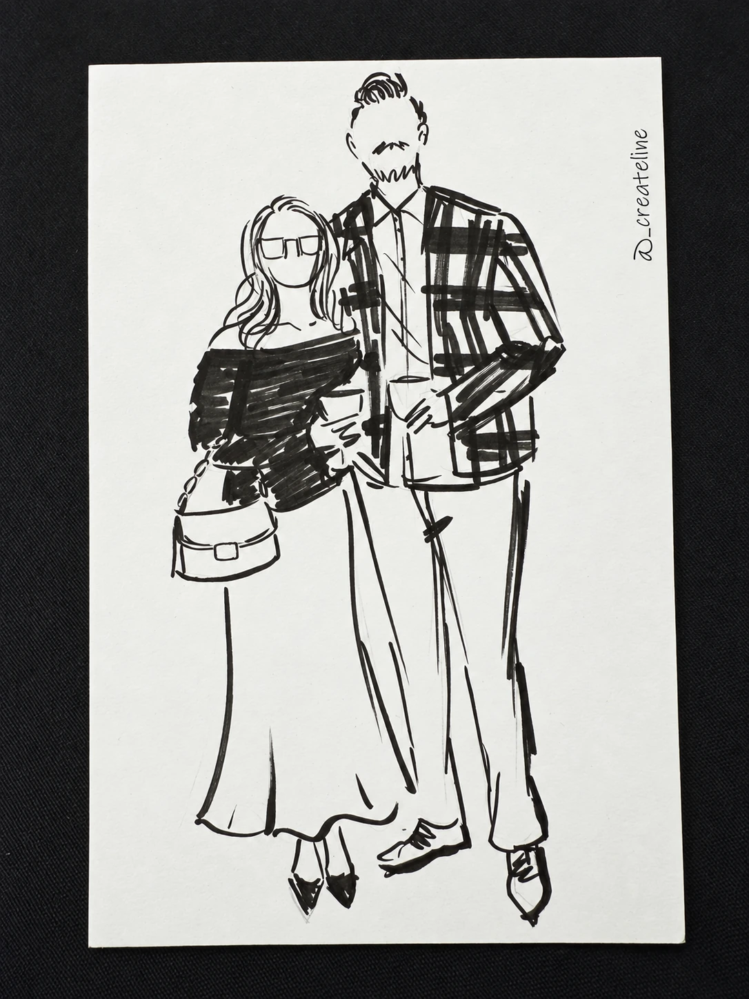 Black-and-white paper fashion sketch of a couple with a plaid jacket and long skirt