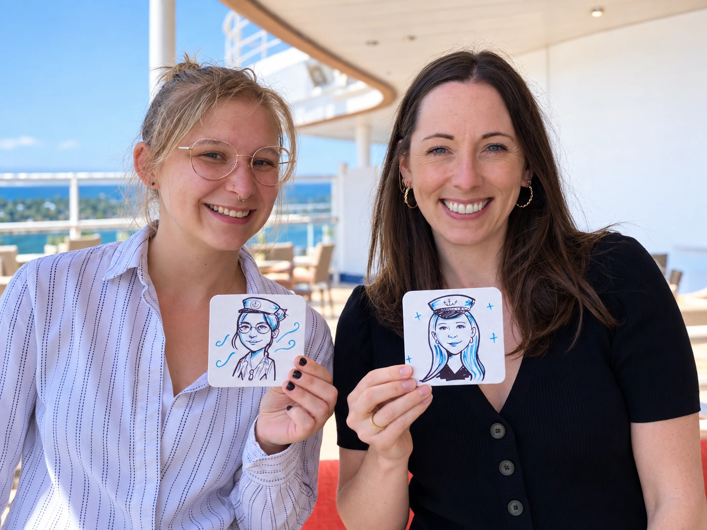 Two guests holding their hand-drawn portraits on square coasters