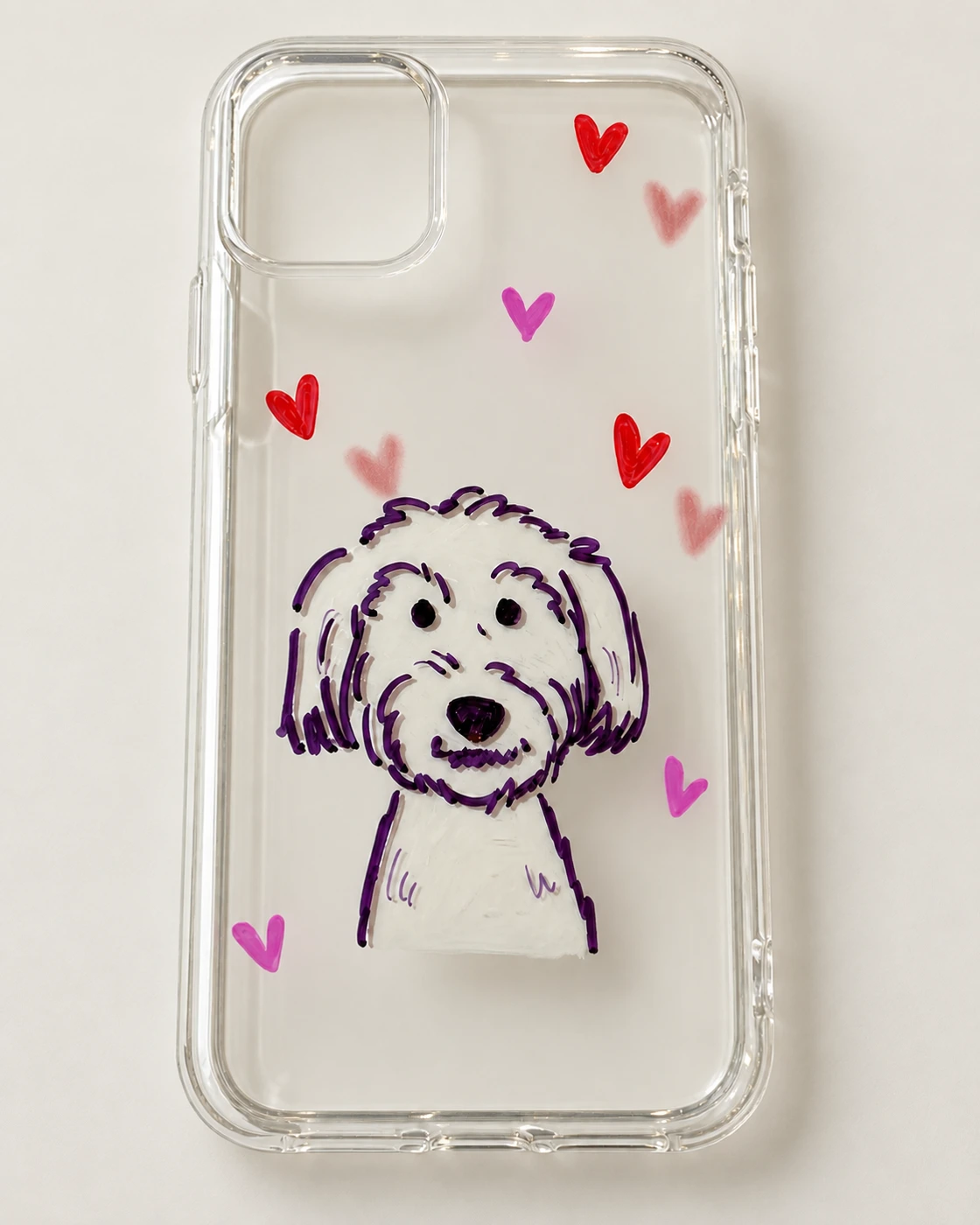Shaggy white dog portrait and red hearts on a clear phone case
