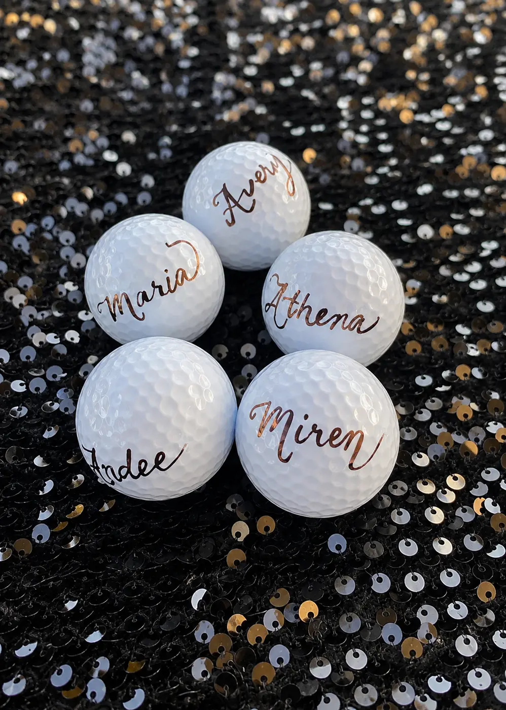 Golf balls with hand-lettered names