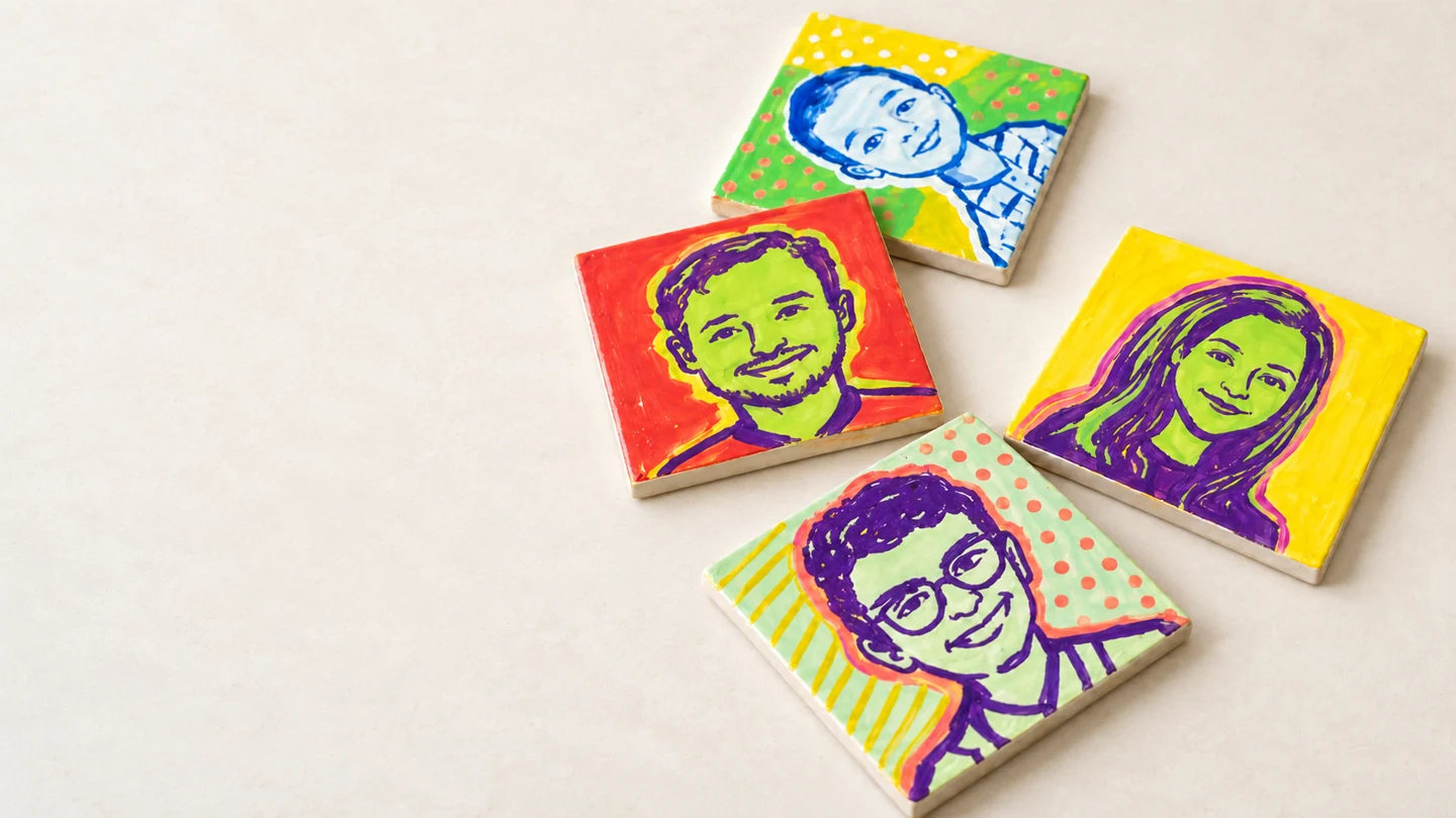 Four hand-painted pop art tiles with colorful portraits