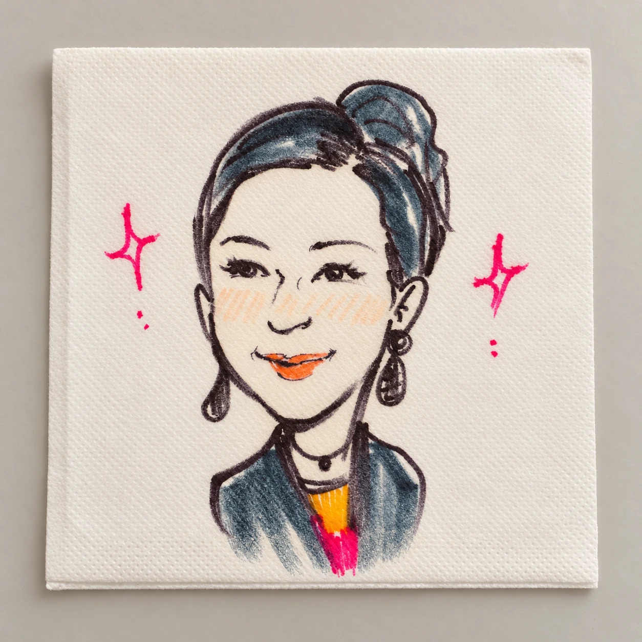 Hand-drawn woman’s portrait with color accents on a cocktail napkin