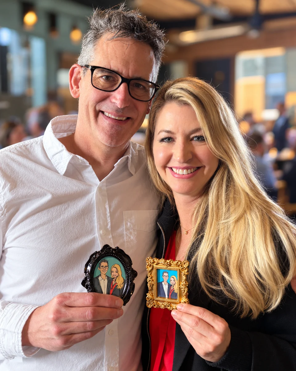 Couple holding their miniature framed portraits
