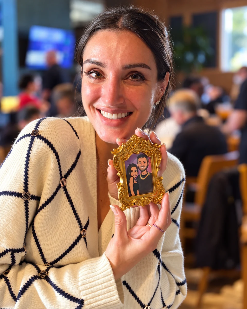 Smiling guest holding her miniature framed portrait
